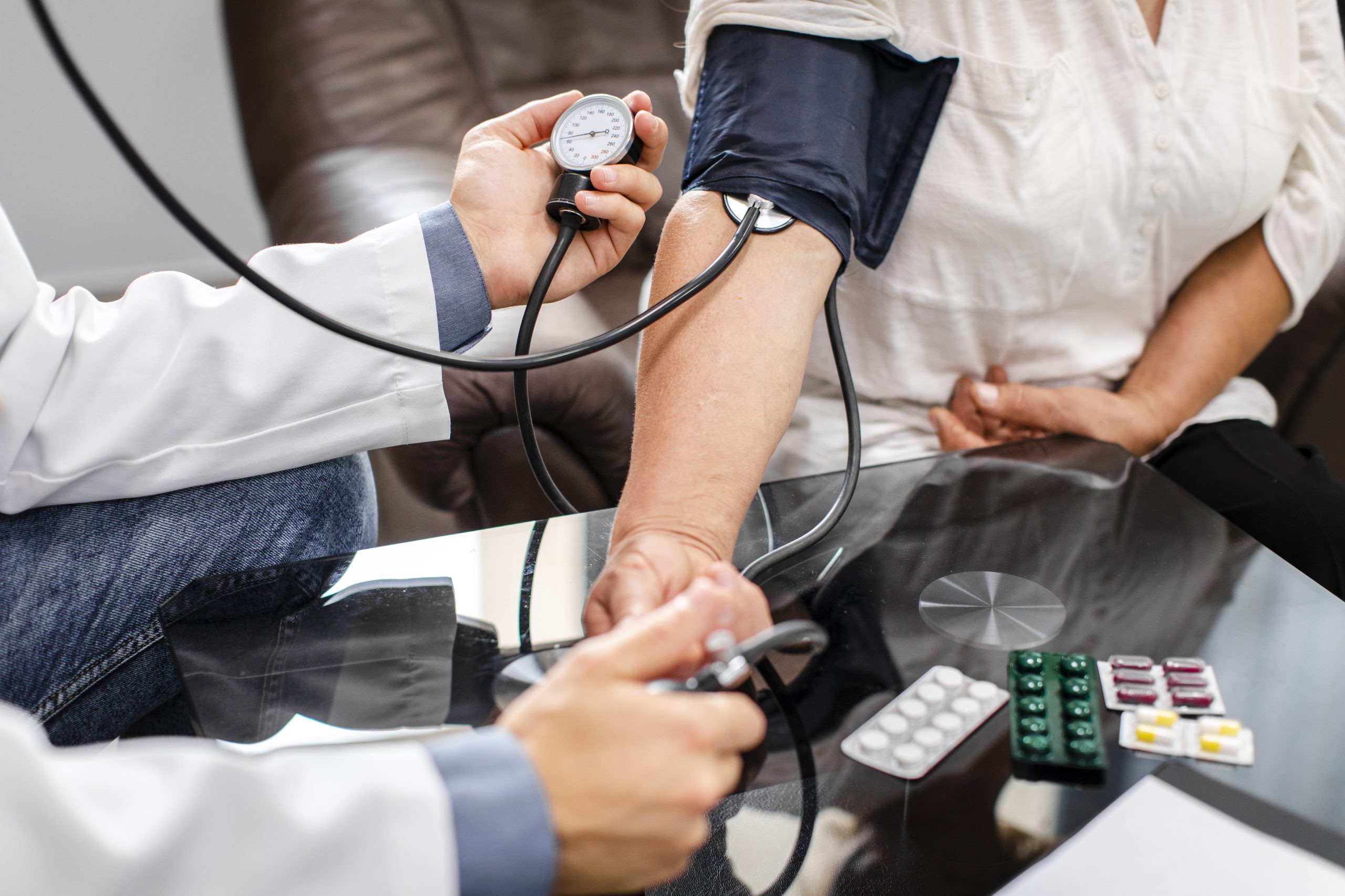 male-doctor-hands-measuring-tension-patient